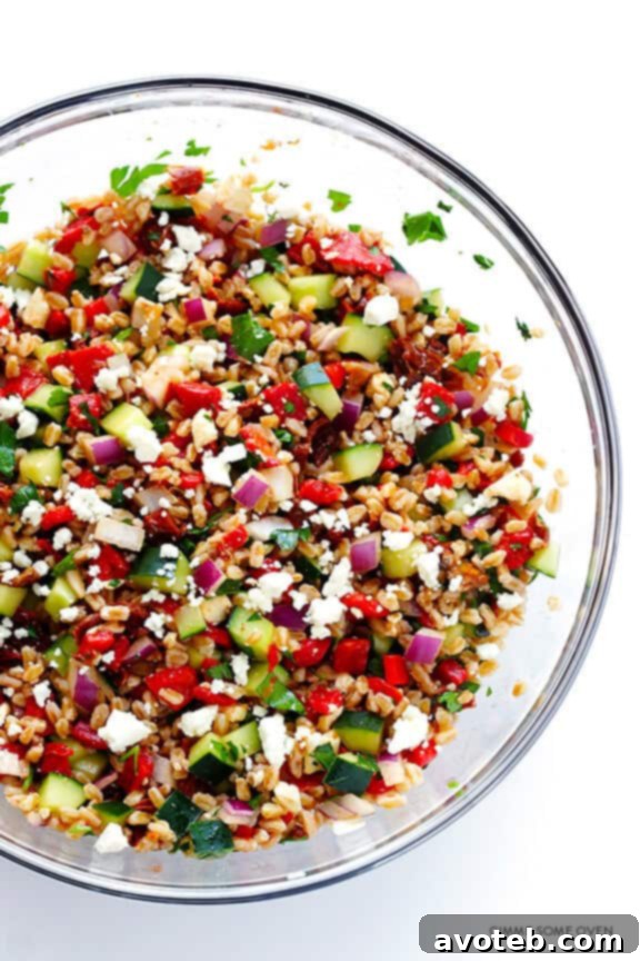 Detail shot of the textures in Mediterranean Farro Salad, highlighting farro and vegetables.