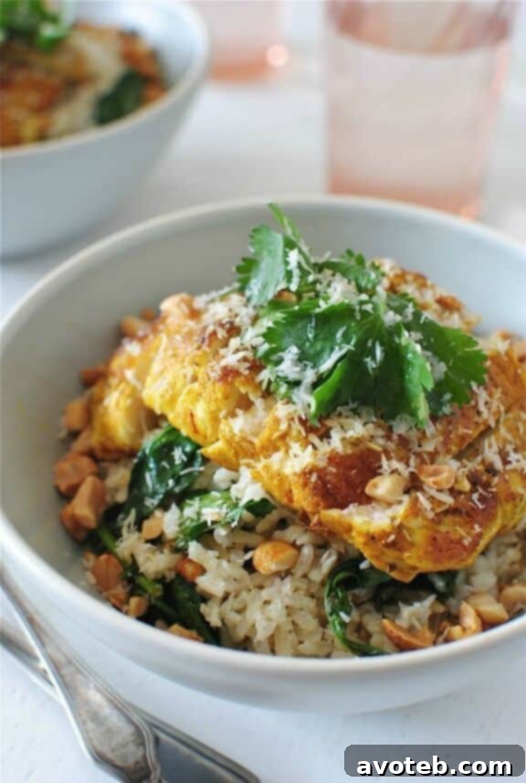 Seared Indian Chicken over Coconut Rice - A flavorful and aromatic Indian-inspired chicken breast recipe served with sweet coconut rice from Bev Cooks.