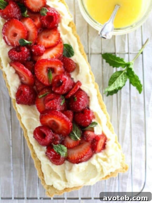 15 Irresistible Strawberry Delights 11 Berry Tart with Lemon Curd Mascarpone, an elegant and fruity dessert.