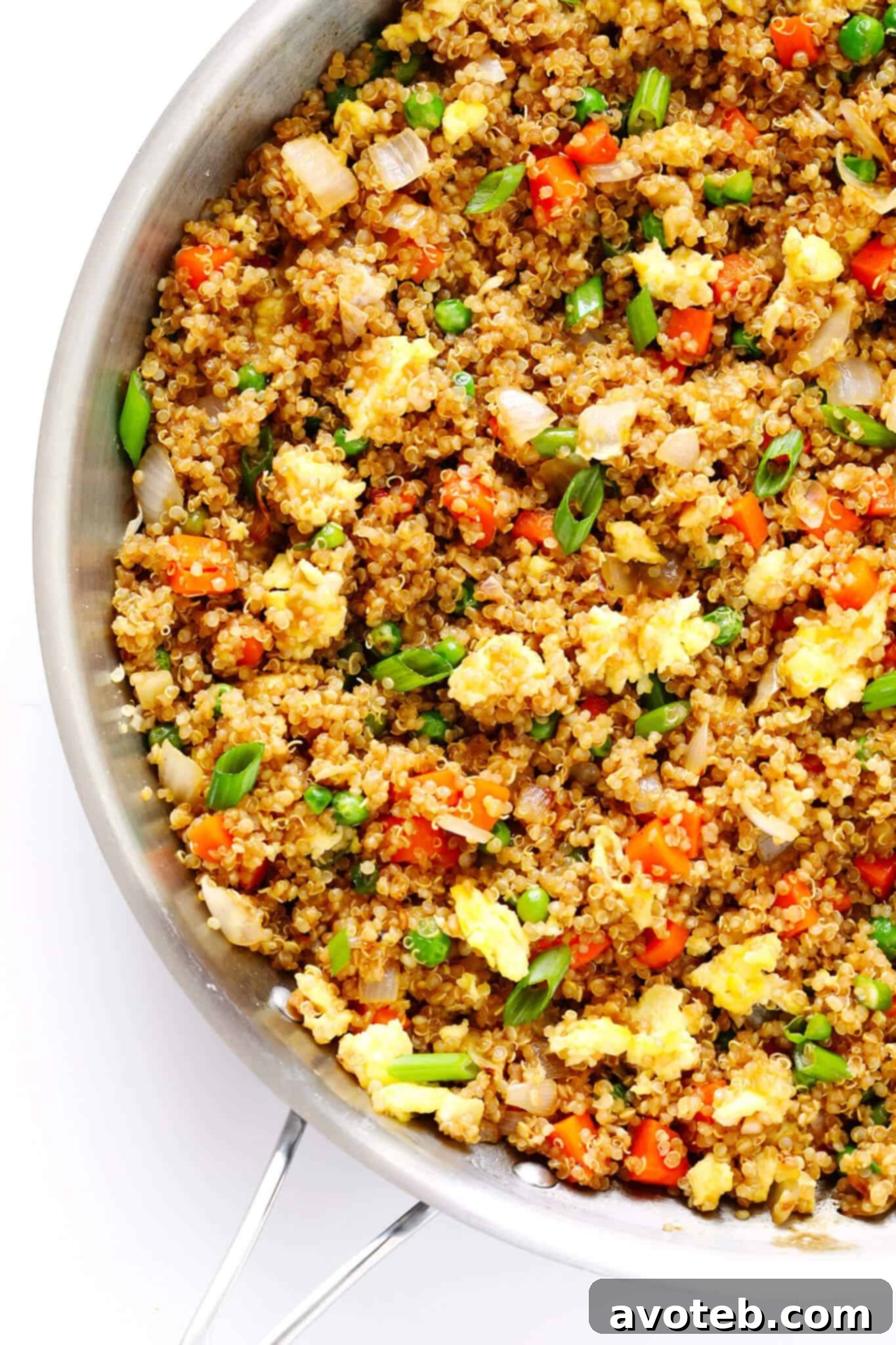 A serving of Quinoa Fried Rice with a fork, showing the texture