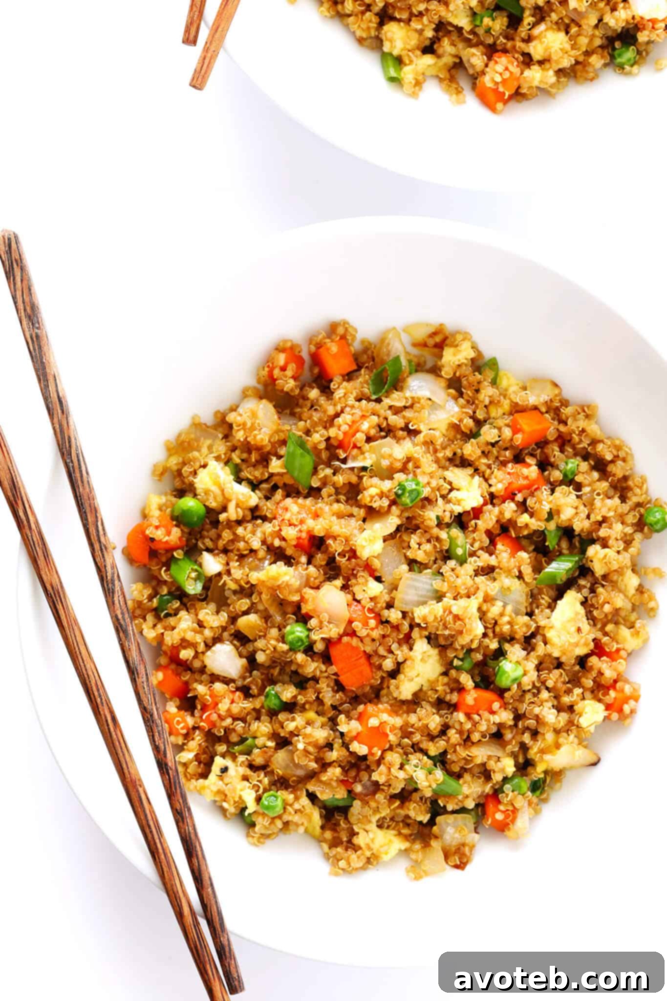 Another close-up of Quinoa Fried Rice in a bowl, garnished with green onions
