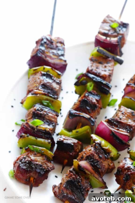 Plated Asian Pepper Steak Kabobs ready to be served with rice