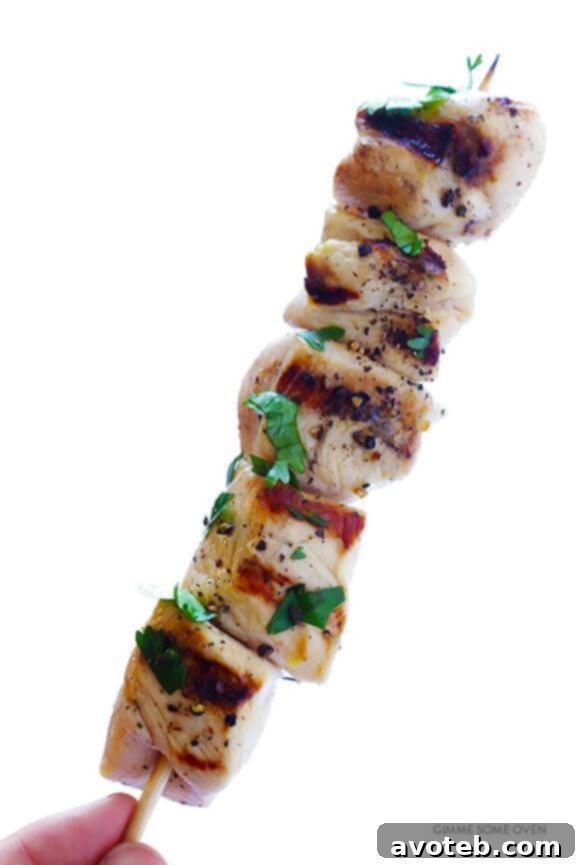 Tequila Lime Chicken Kabobs grilling on an outdoor barbecue