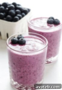 Blueberry Muffin Smoothie in a glass with fresh blueberries