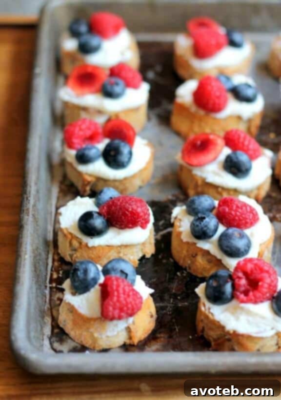 15 Naturally Vibrant Red, White, and Blue Recipes 4 Summer Berry Crostini with Lemon Ricotta & Honey | ambitiouskitchen.com