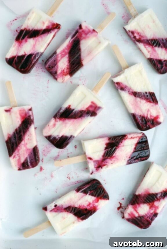 Striped Berry Buttermilk Popsicles with layers of fruity goodness