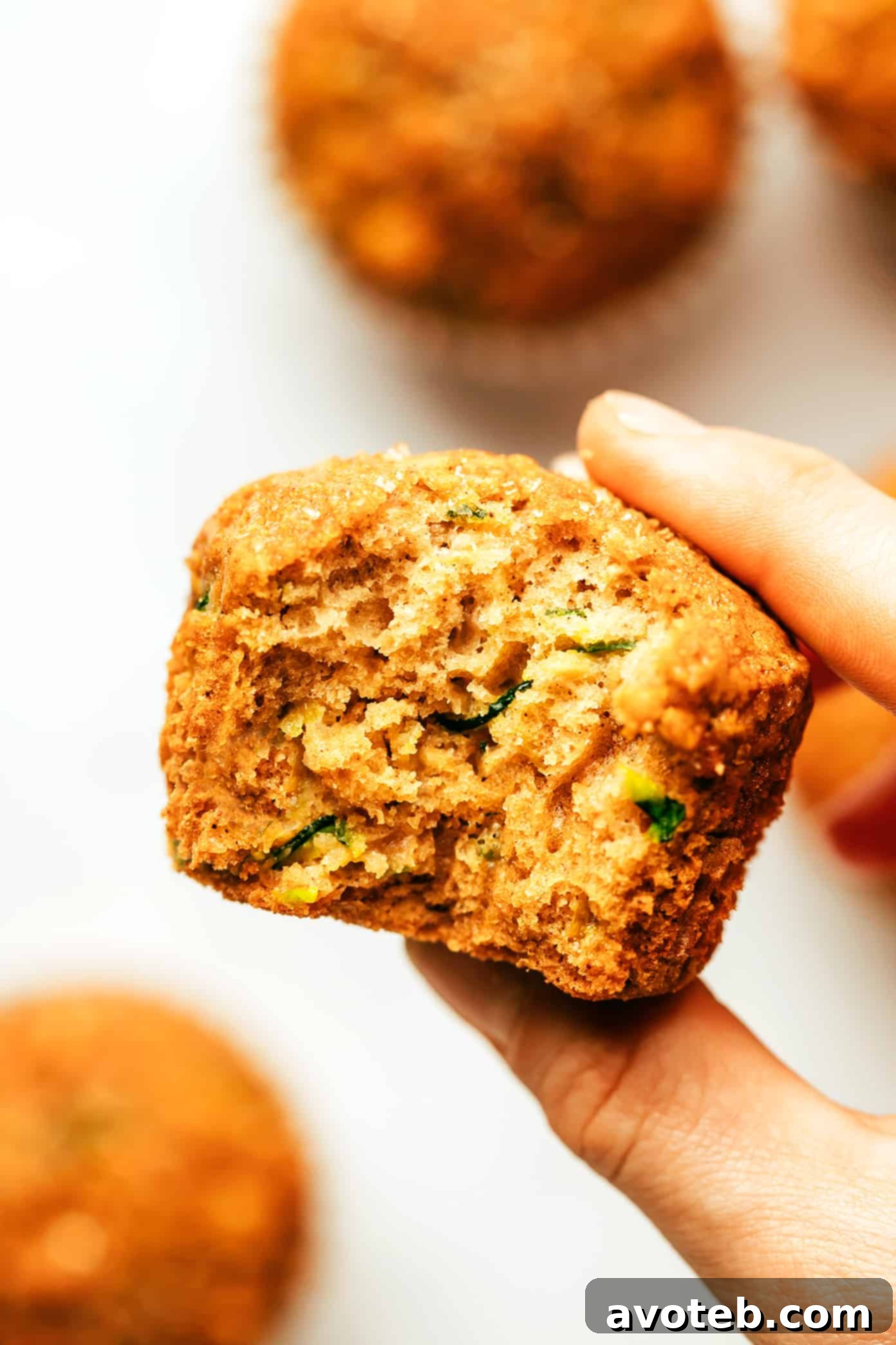 A basket filled with freshly baked healthy zucchini muffins, ready to be enjoyed.