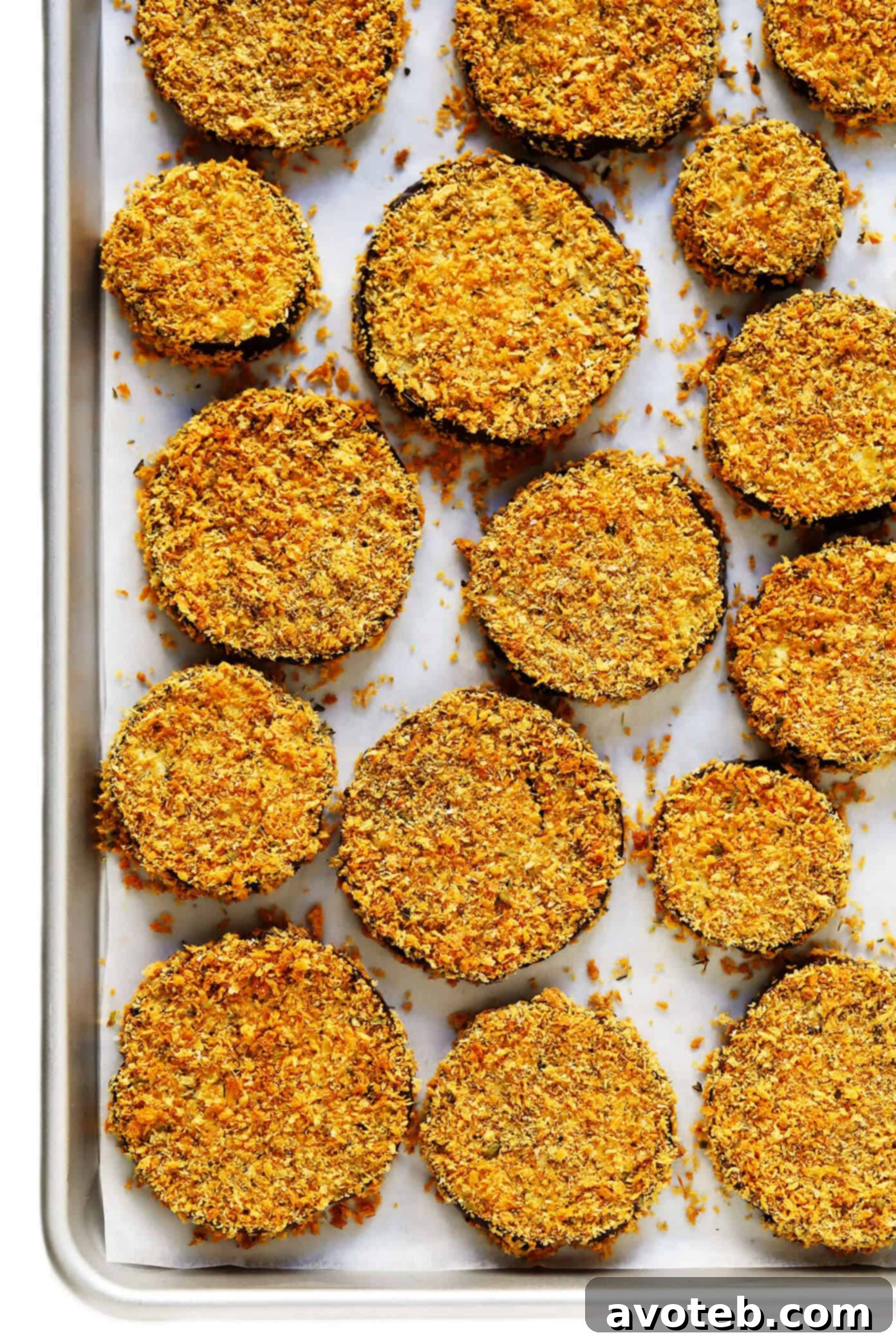 This Baked Eggplant Parmesan recipe is lightened up a bit with Panko-crusted baked (instead of fried) roasted eggplant, and layered with marinara tomato sauce, mozzarella cheese, fresh basil, and lots and lots of Parmesan. It's the perfect vegetarian casserole for Italian night, and always winner! | gimmesomeoven.com #eggplant #parmesan #vegetarian #casserole #glutenfree #italian #comfortfood #lasagna Crispy Oven-Baked Panko-Crusted Roasted Eggplant Rounds