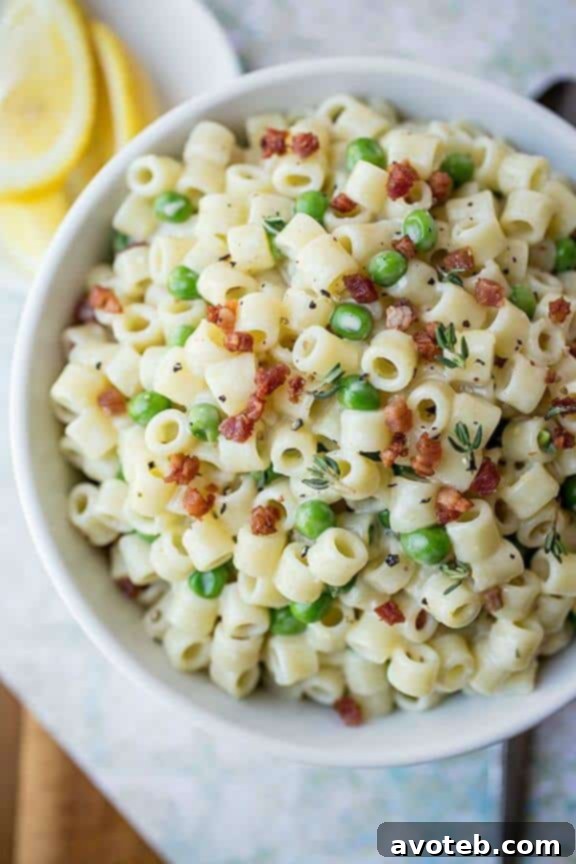 Summer Macaroni Salad with Crispy Pancetta and Petite Peas in a Bright & Creamy Lemon-Thyme Dressing | thecozyapron.com