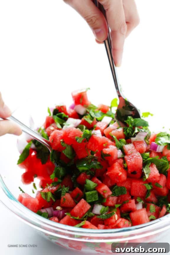 Diced red onion, cilantro, mint, and jalapeño ready to be mixed into watermelon salsa.