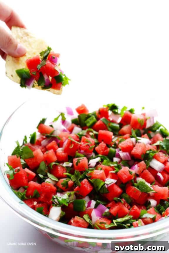 All ingredients for watermelon salsa tossed together in a bowl.