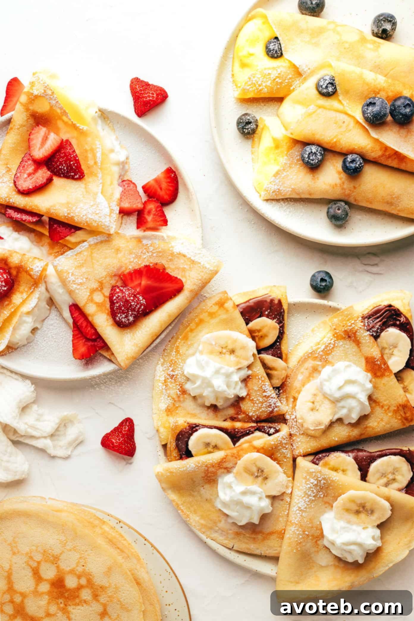 An assortment of different filled crepes arranged artistically