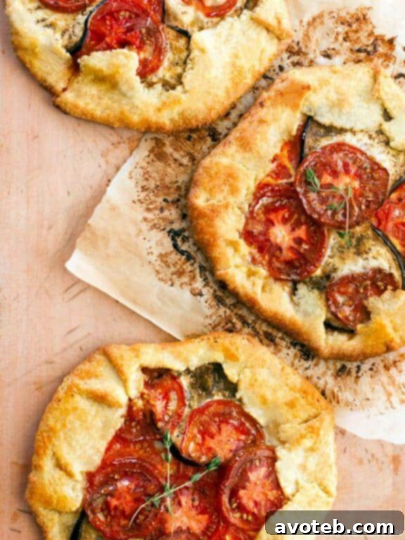 Heirloom Tomato and Eggplant Galette, a rustic and flavorful tart perfect for a summer main course or elegant side.