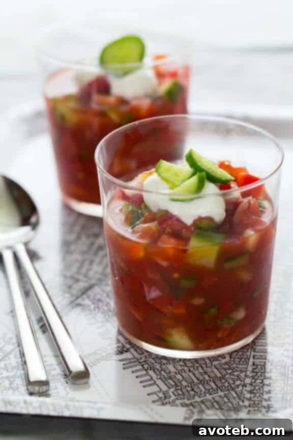 A refreshing bowl of traditional Spanish Gazpacho, a chilled tomato and vegetable soup, ideal for hot summer days.
