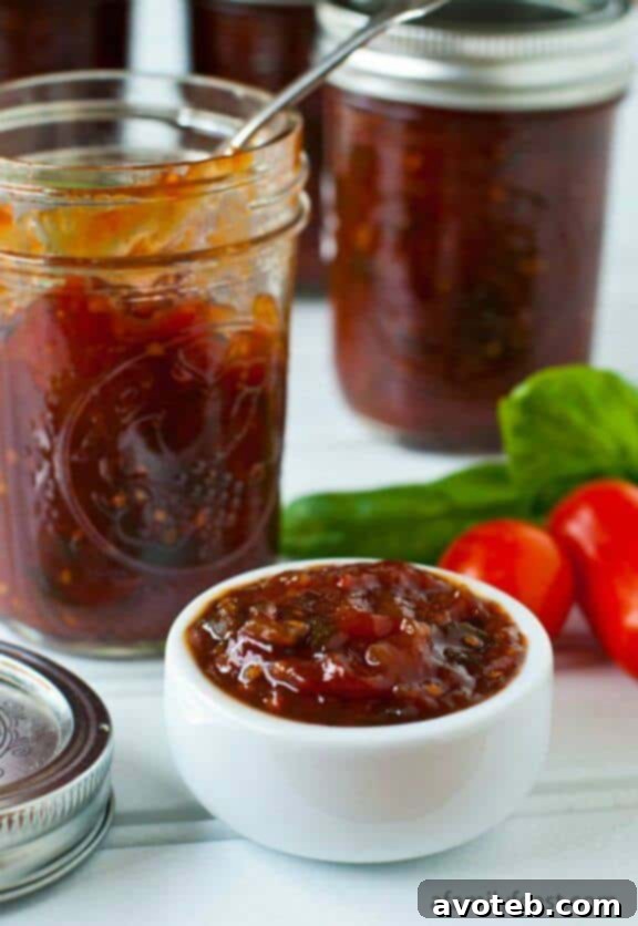 Sweet and savory Tomato Jam, a versatile condiment perfect for sandwiches, cheese boards, or grilled meats.