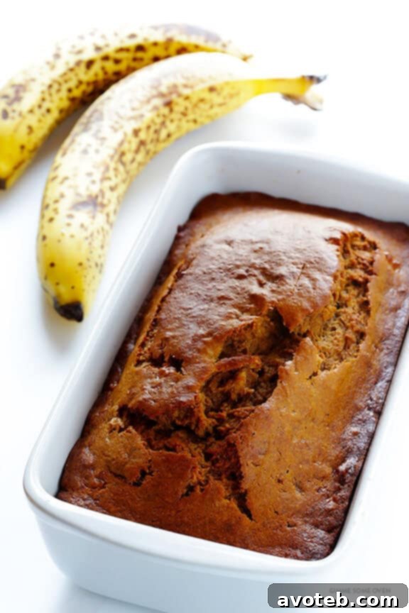 Close-up of a slice of moist banana bread, showing its delicious texture.