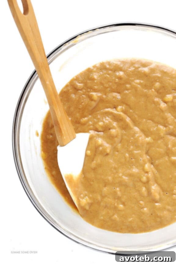 Mixing dry ingredients in one bowl for banana bread.
