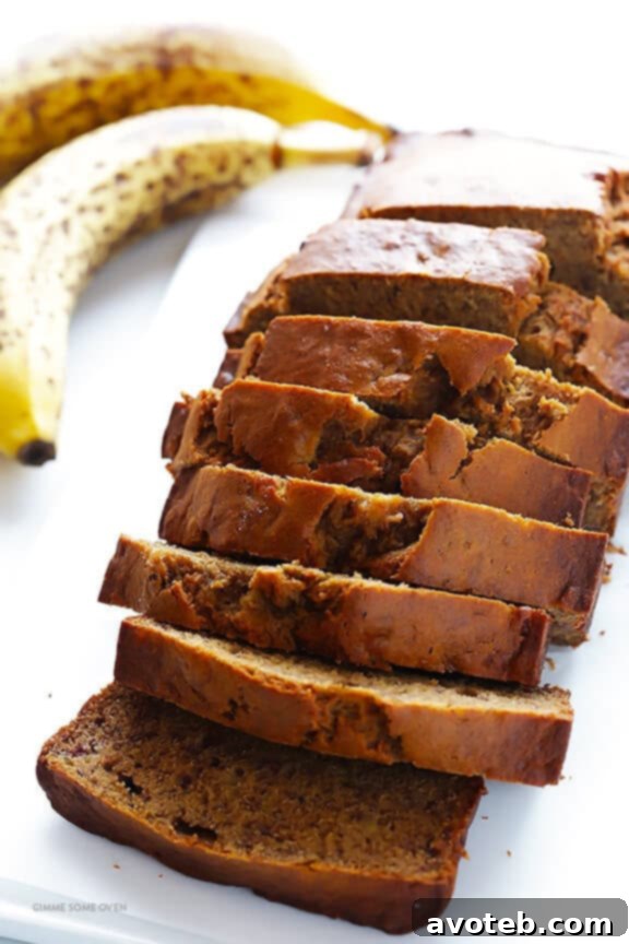 Freshly baked banana bread cooling on a wire rack.