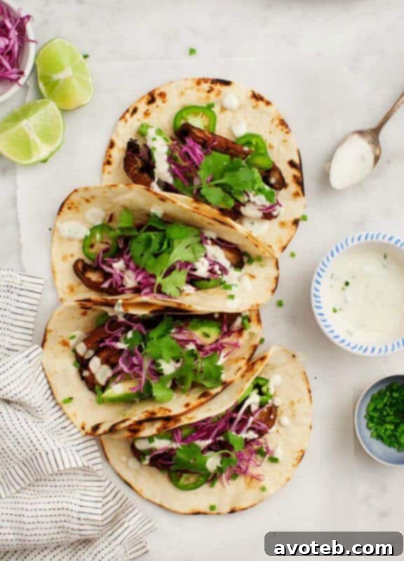 15 Creative Taco Recipes 12 Portobello Tacos with Vegan Jalapeño Sauce Recipe | A savory and plant-based taco option from Love and Lemons.