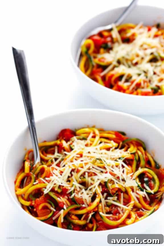 A delicious bowl of Zoodles Marinara with chunky tomato sauce, a perfect healthy, gluten-free, and vegetarian meal option.