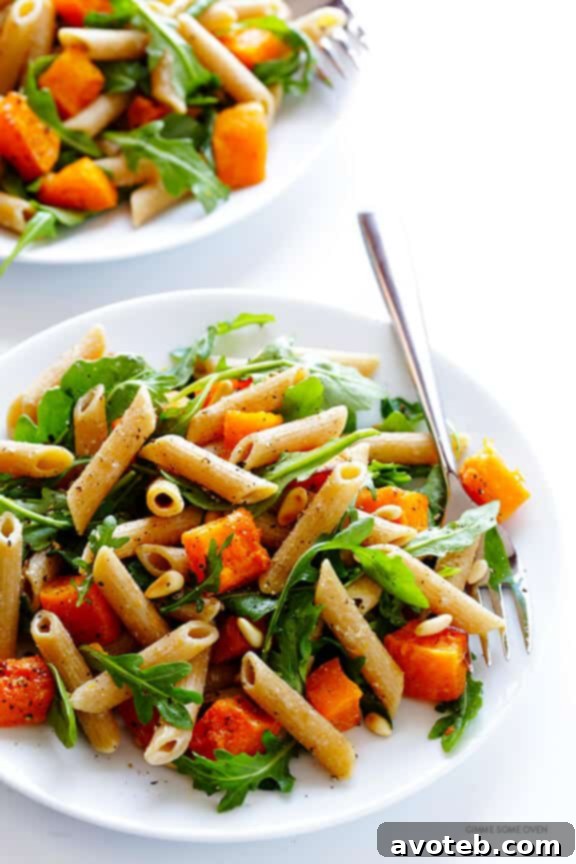 5-Ingredient Butternut Squash Pasta with Arugula and Goat Cheese 3 Close-up of a bowl of Butternut Squash, Arugula, and Goat Cheese Pasta, showcasing the vibrant colors and creamy texture