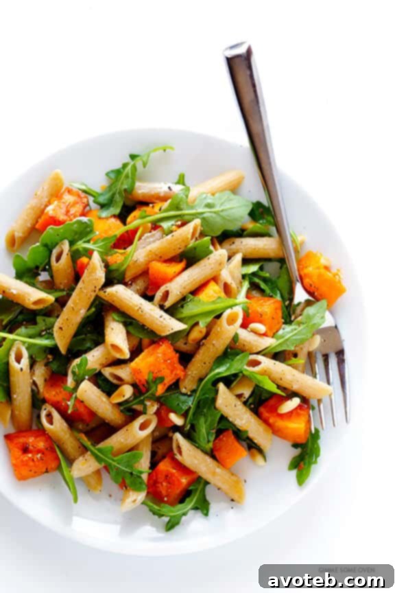 5-Ingredient Butternut Squash Pasta with Arugula and Goat Cheese 9 An appetizing close-up of the ready-to-eat 5-Ingredient Butternut Squash, Arugula, and Goat Cheese Pasta