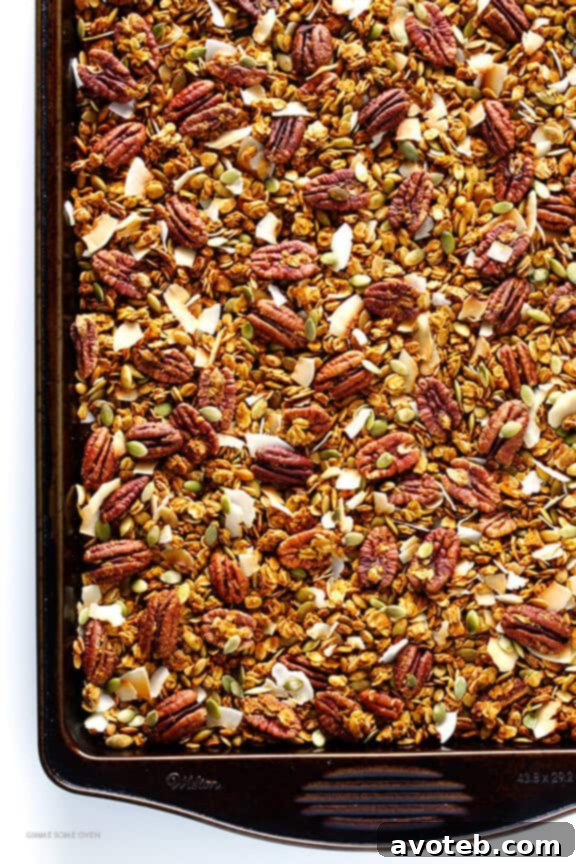 Pumpkin Spice Granola baking on a sheet pan