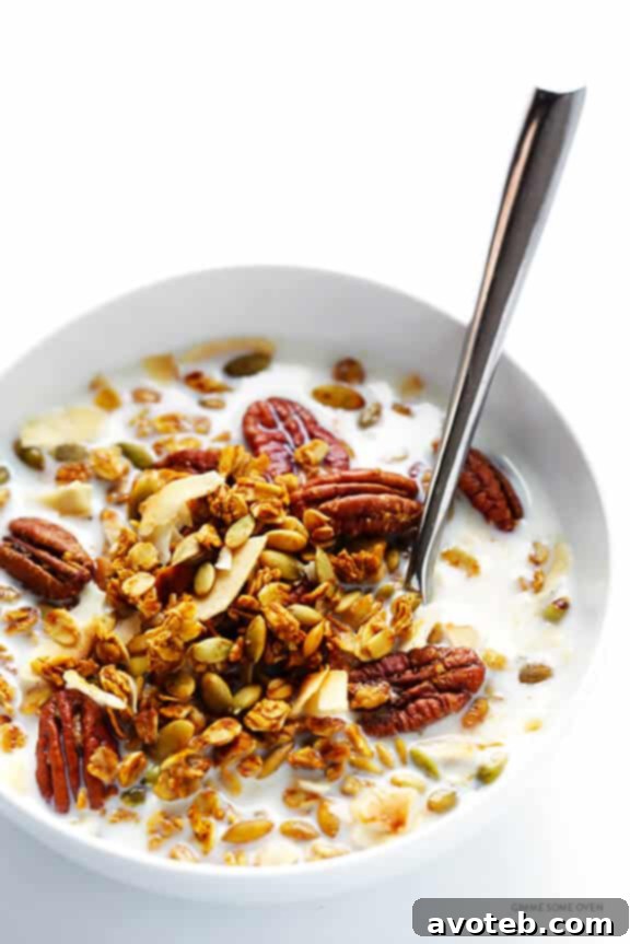 Serving Pumpkin Spice Granola with milk and berries
