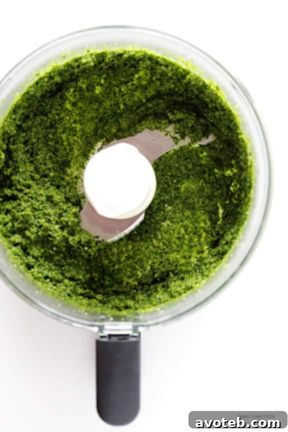 Vibrant green homemade Kale Basil Pesto, ready to be added to gnocchi