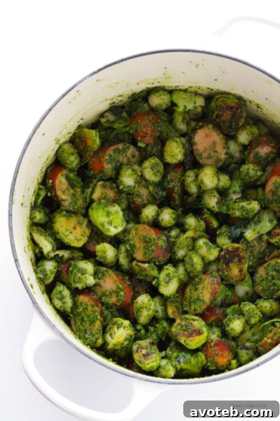 Sautéed Brussels Sprouts with cooked chicken sausage, ready to be combined with gnocchi and pesto