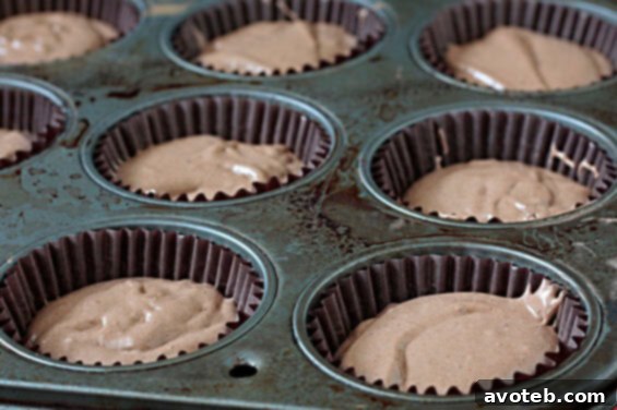 Close-up of a Mayan Chocolate Cupcake with rich Cocoa-Cinnamon Buttercream, ready to be enjoyed.