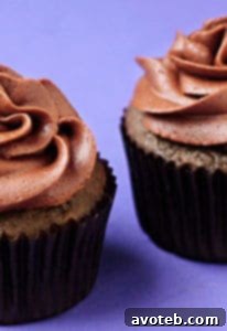 A beautifully decorated Mayan Chocolate Cupcake topped with cocoa-cinnamon buttercream, ready to serve.