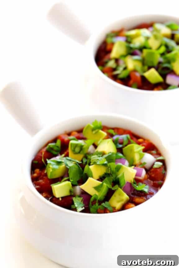 Slow Cooker Vegetarian Chili Recipe -- easy to make in the crock pot or on the stovetop, naturally gluten-free and vegan, and SO delicious! | gimmesomeoven.com