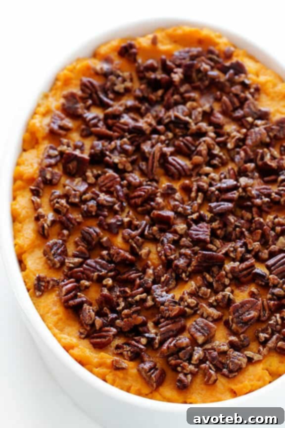 Healthier Sweet Potato Casserole -- naturally sweetened with a hint of maple syrup, and topped with cinnamon pecans