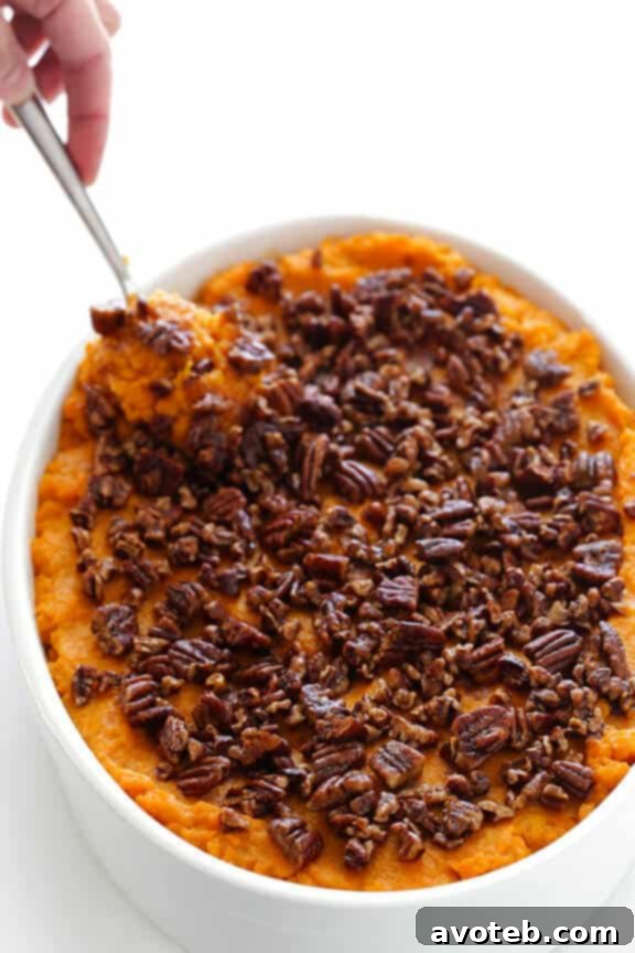 Healthier Sweet Potato Casserole -- naturally sweetened with a hint of maple syrup, and topped with cinnamon pecans