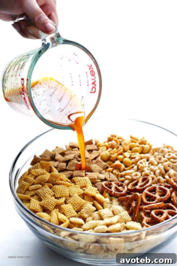 Pretzels, peanuts, and Cheerios – essential add-ins for the perfect Chex Mix.