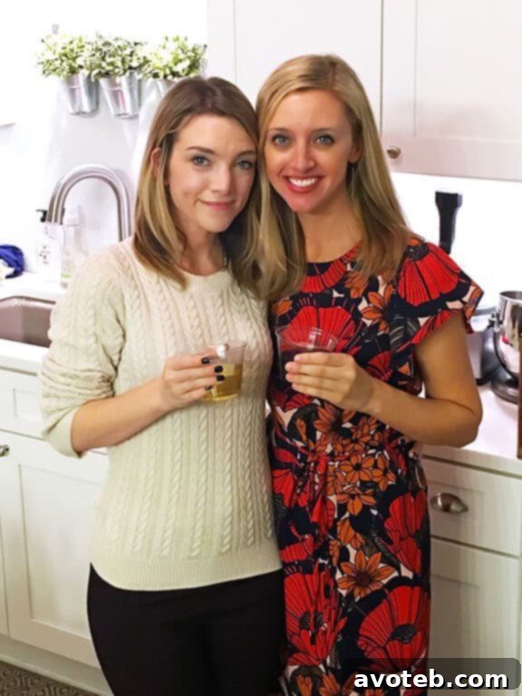 Gooey Cranberry Brie Bites 5 Two cheerful friends, one holding a glass of wine, smiling together at a festive Neighborsgiving party