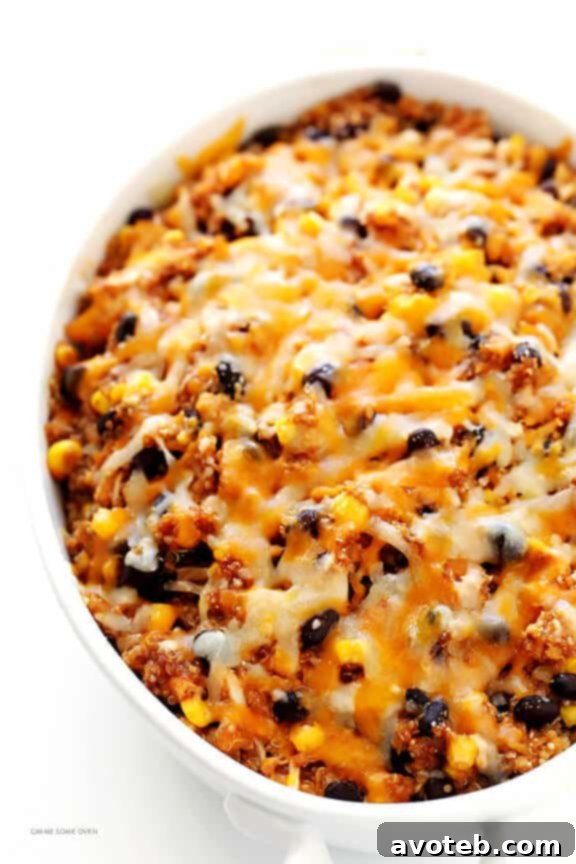 BBQ Chicken Quinoa Casserole in baking dish, topped with cheese and ready for oven.