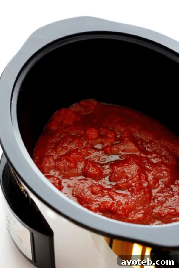 This Slow Cooker Lasagna recipe is easy to make in the crock pot, it takes just minutes to prep, and you can customize it with all of your favorite ingredients.