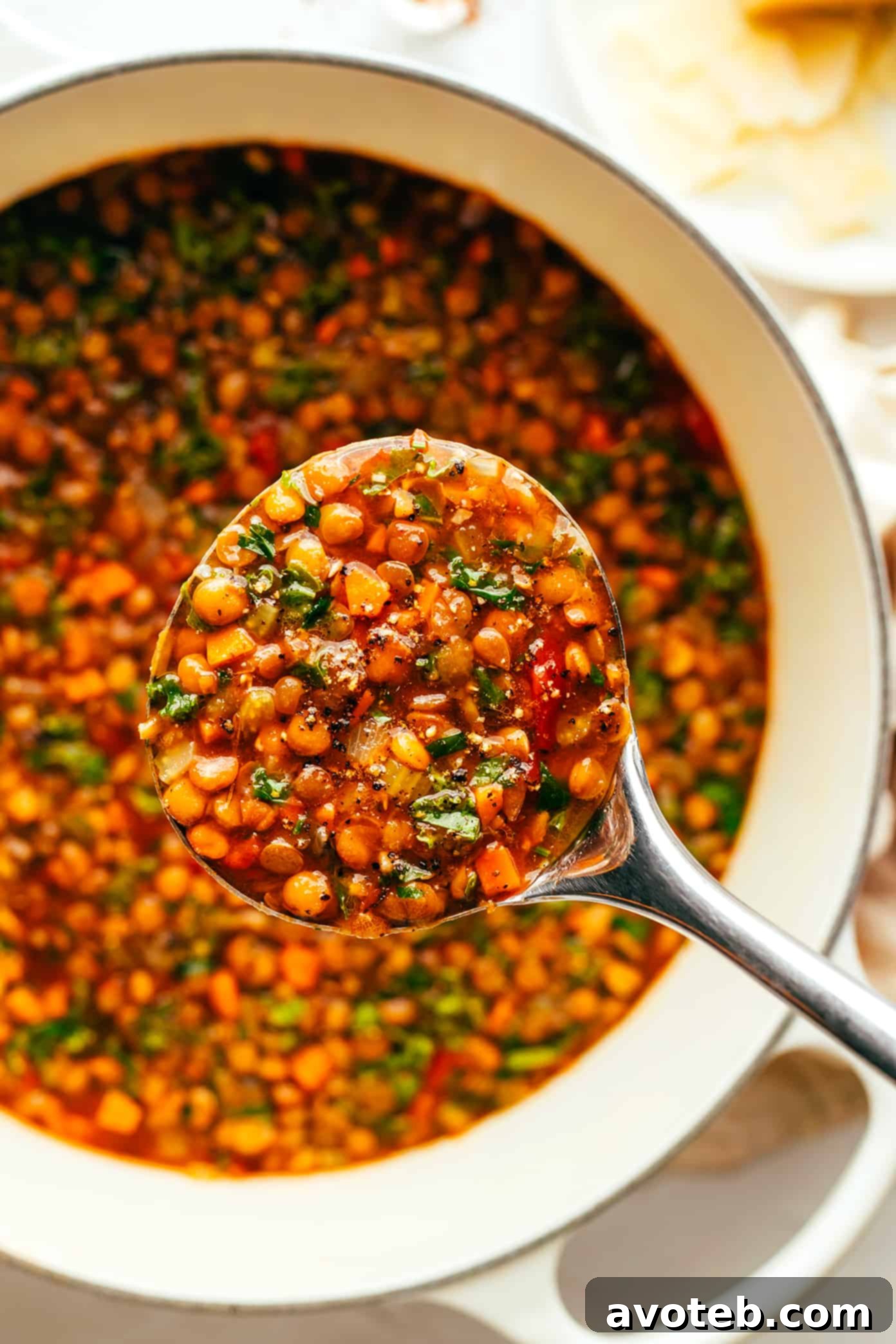 Ladle of Italian Lentil Soup in a Large Stockpot
