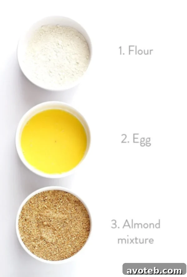 Almond-Crusted Chicken Nuggets -- easy to make, baked instead of fried, and irresistibly delicious! | gimmesomeoven.com