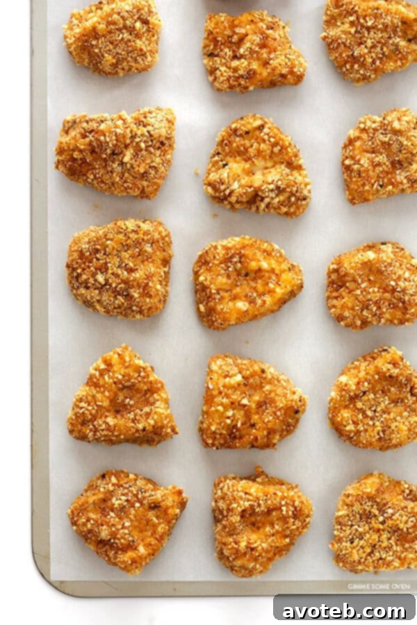 Almond-Crusted Chicken Nuggets -- easy to make, baked instead of fried, and irresistibly delicious! | gimmesomeoven.com