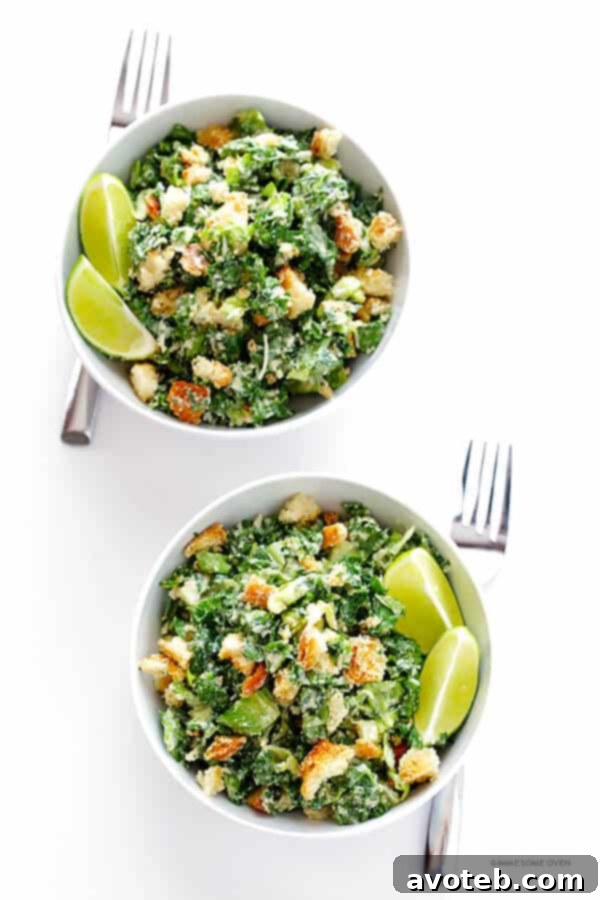 Ready-to-serve Kale Caesar Salad with fresh lime wedges