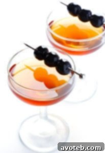 Classic Manhattan cocktail garnished with a rich Luxardo cherry.