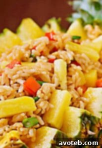Pineapple Fried Rice with chili and cilantro garnish