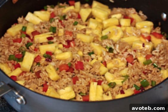 Pineapple Fried Rice | gimmesomeoven.com Close-up of Pineapple Fried Rice in a pan, ready to serve.