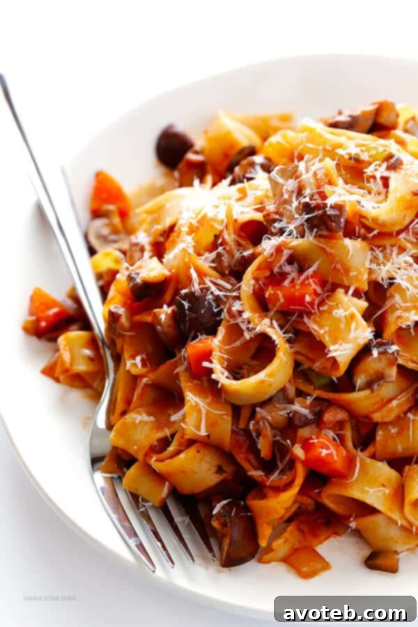 Hearty Mushroom Ragu 3 Close-up of chopped assorted fresh mushrooms, including cremini, shiitake, and porcini.