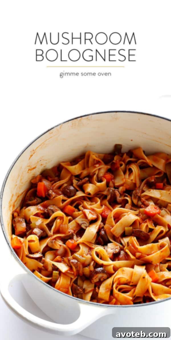Hearty Mushroom Ragu 9 Overhead shot of a bowl of Mushroom Bolognese pasta with a fork, ready to be eaten.