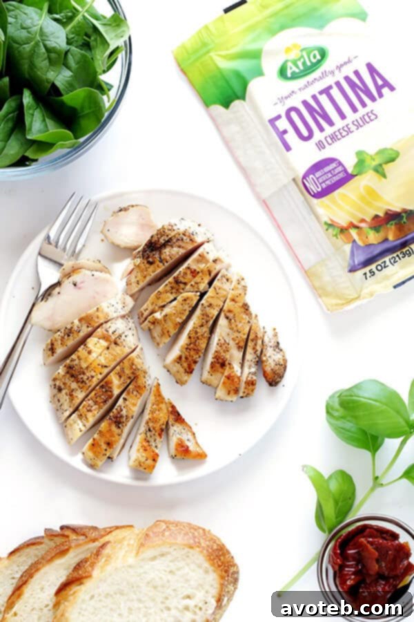 Close-up of a Chicken Florentine Grilled Cheese, showing the melted cheese and flavorful fillings.