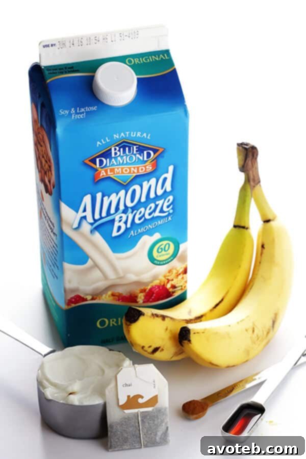 Final Banana Chai Smoothie in a glass, ready to be enjoyed. A quick, easy, protein-packed, and wonderfully delicious drink.
